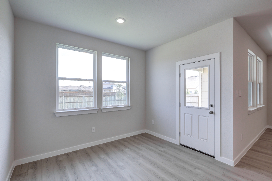 A room with a door and windows.