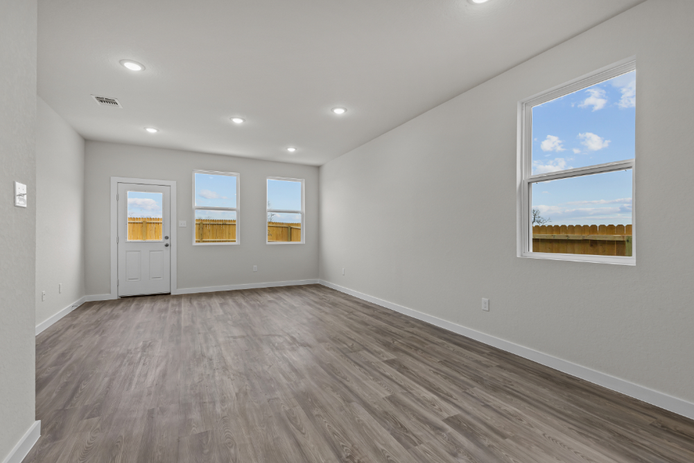 A room with a wood floor and a wood floor with a wood floor.