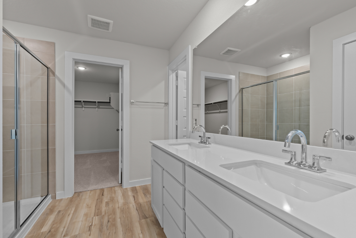 A bathroom with a glass shower.