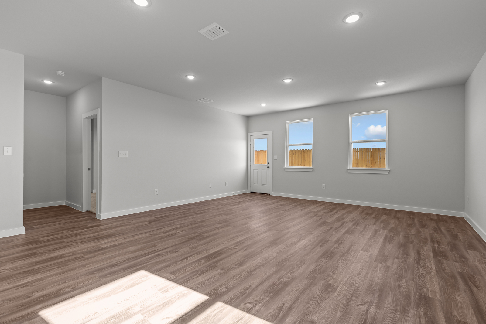 A room with a wood floor and a wood floor.