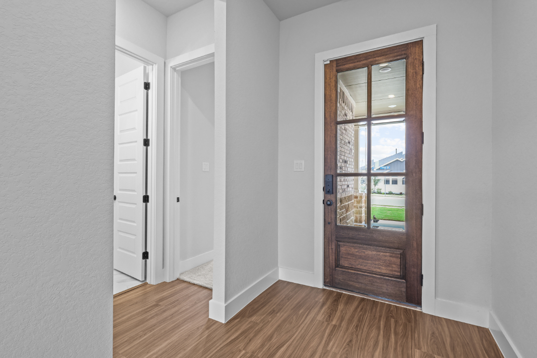 A room with a door and a window.