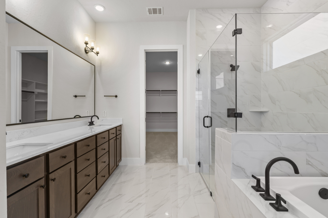 A bathroom with a glass shower.
