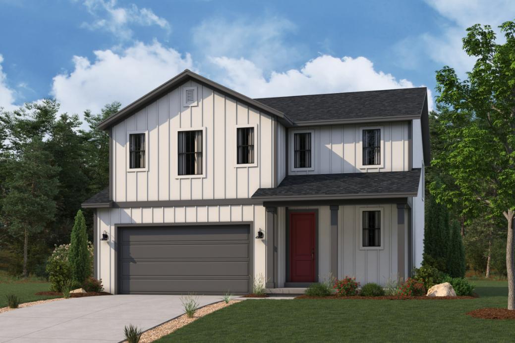 A white house with a garage.