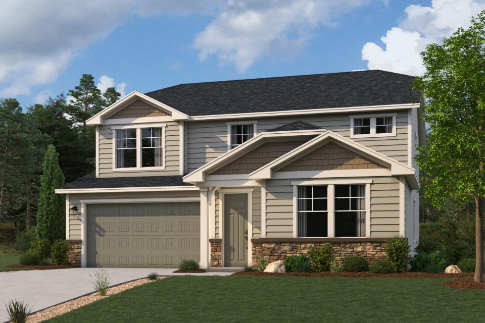 A house with a lawn in front of it.