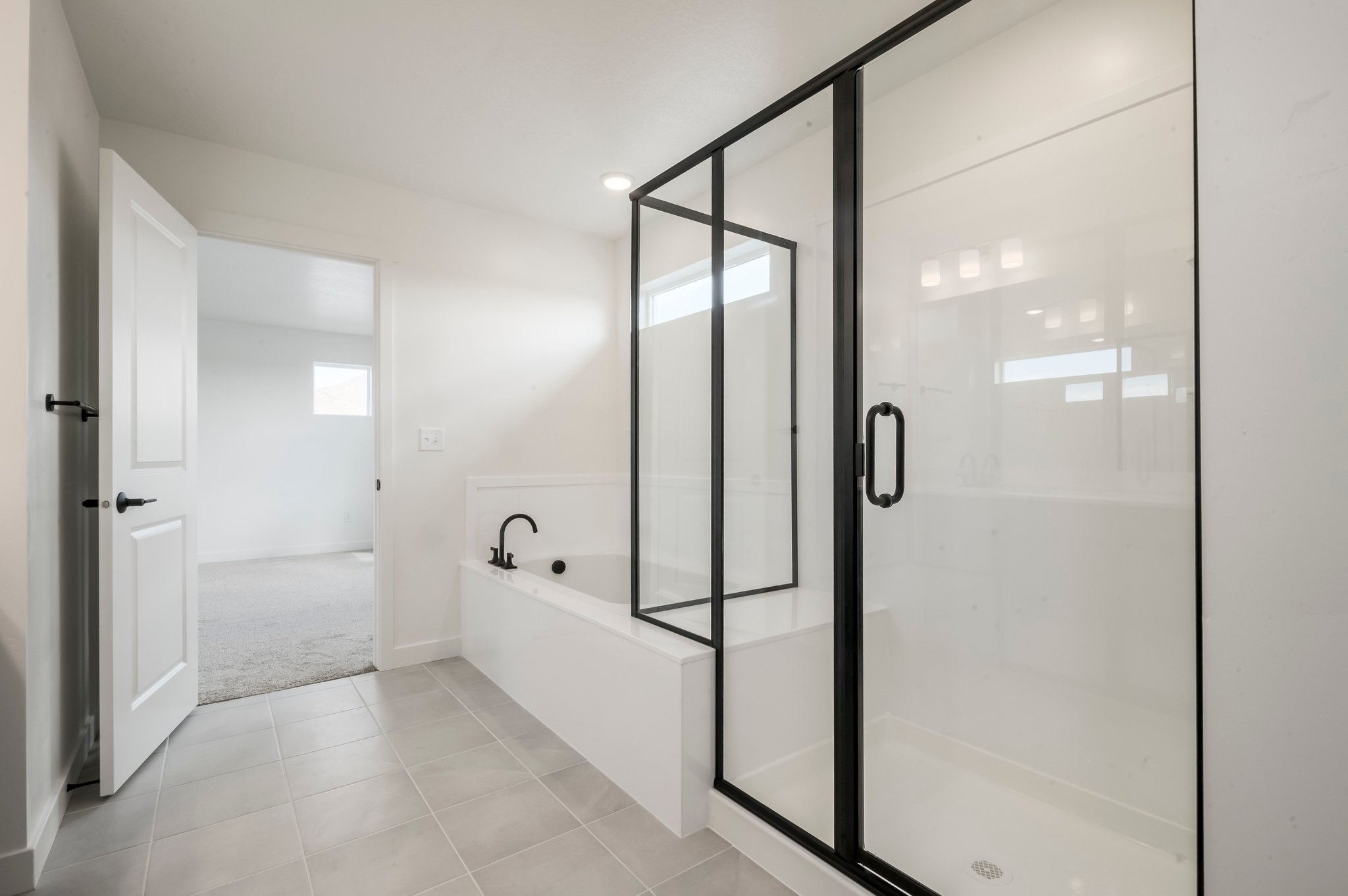 A bathroom with a glass shower.