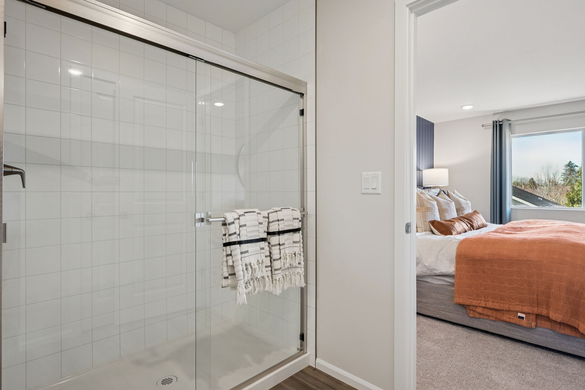 A bathroom with a glass shower.