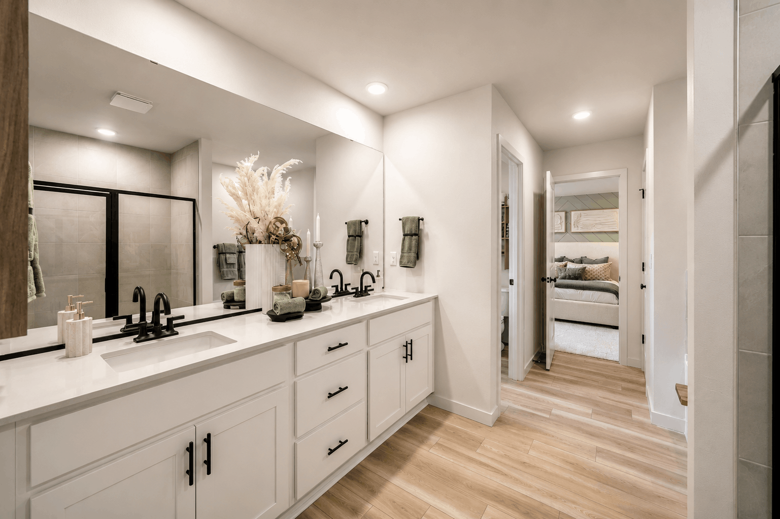A bathroom with a large mirror.