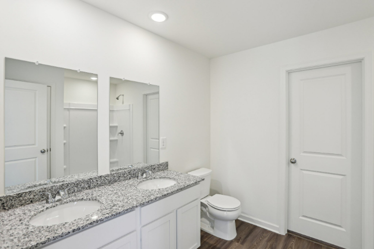 A bathroom with a marble countertop.
