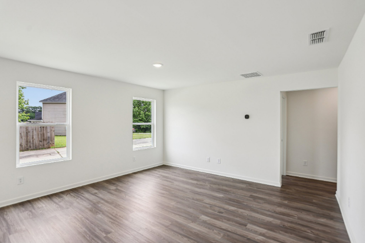 A room with a wood floor and a wood floor.