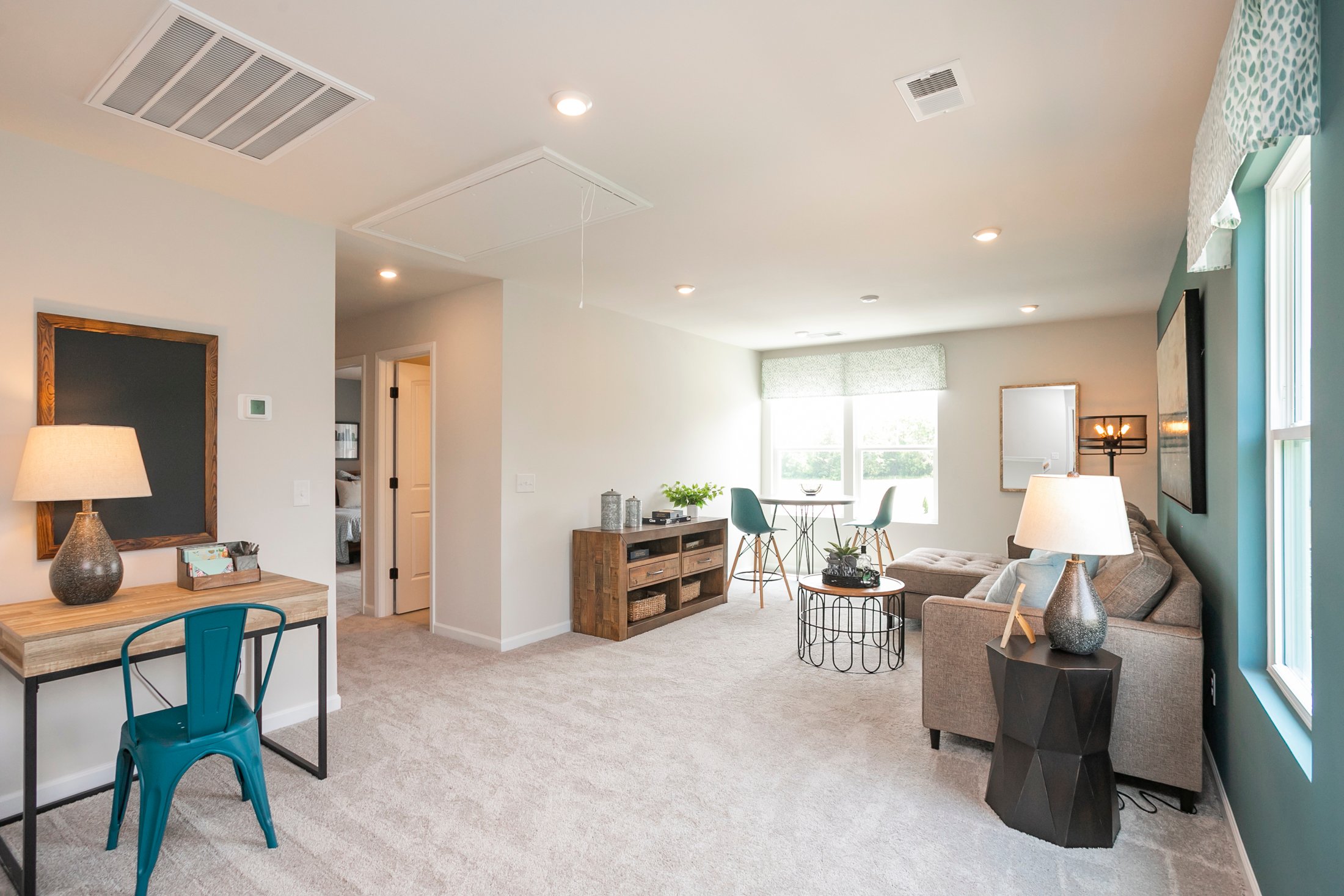 A living room with a couch and a table.