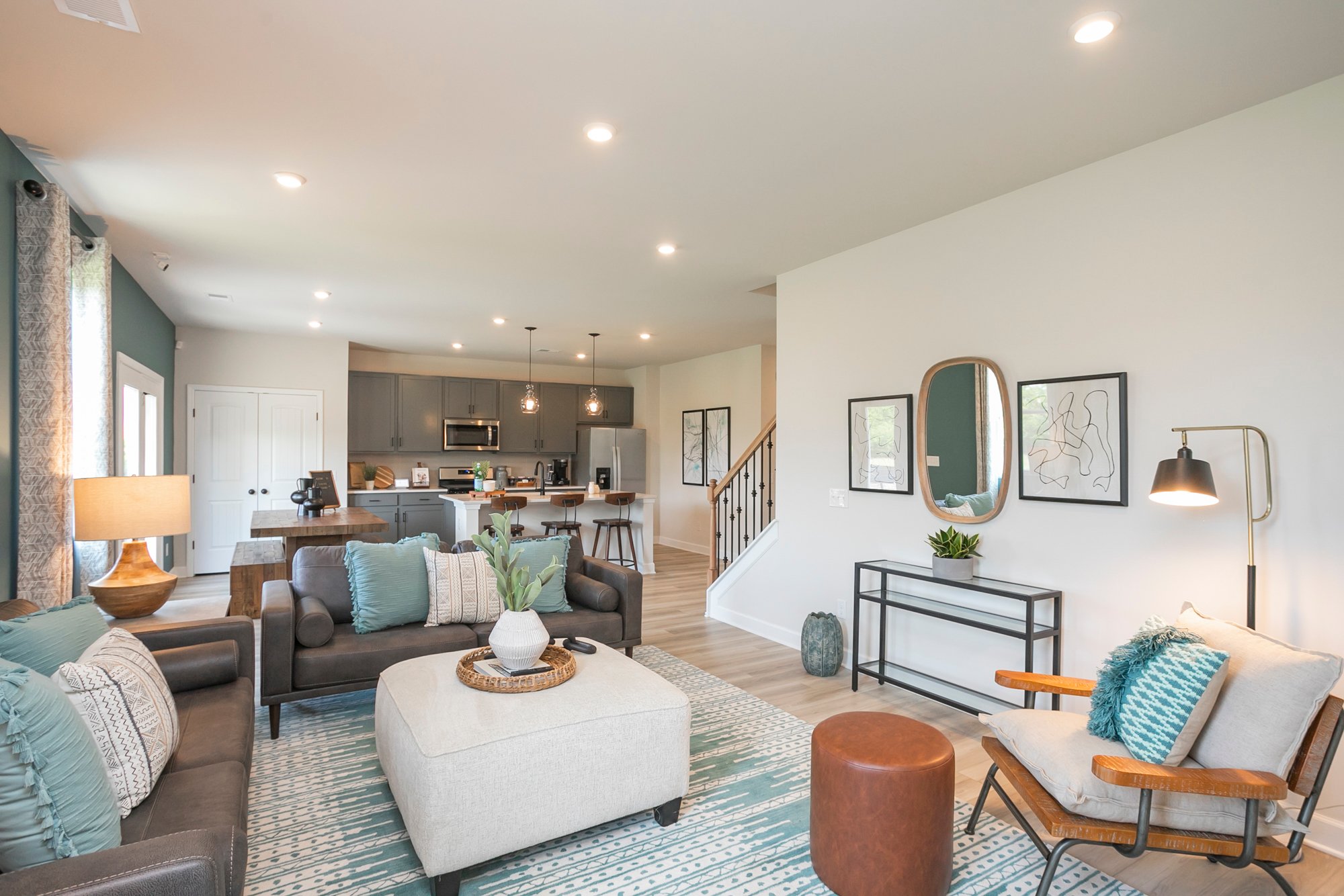 A living room with a large chandelier and a large mirror.