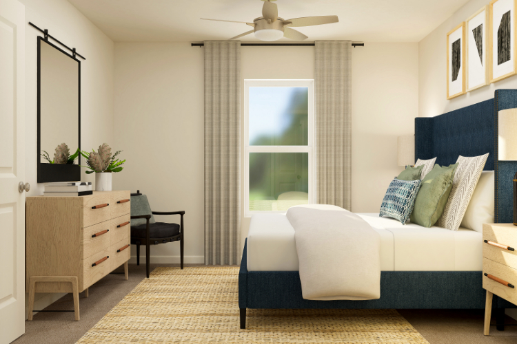 A bedroom with a bed and a chair.