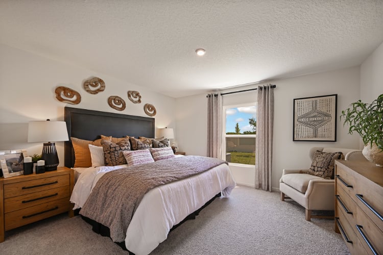 A bedroom with a large bed.