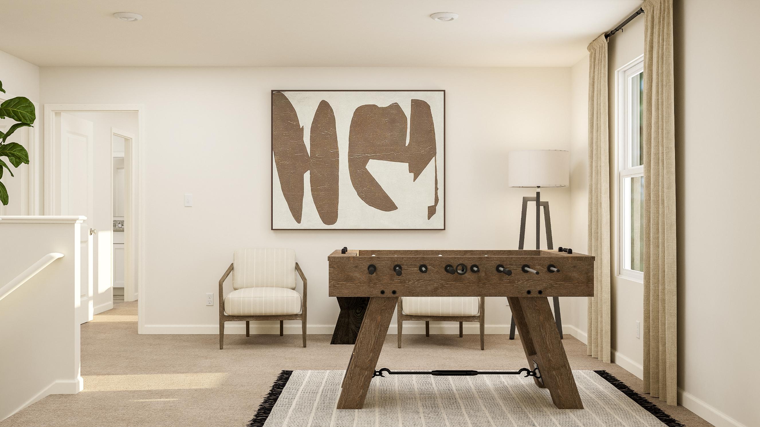 A room with a table and chairs.