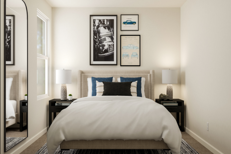 A bed with a blue and white comforter.