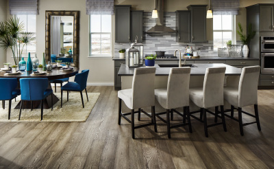 A kitchen with a table and chairs.